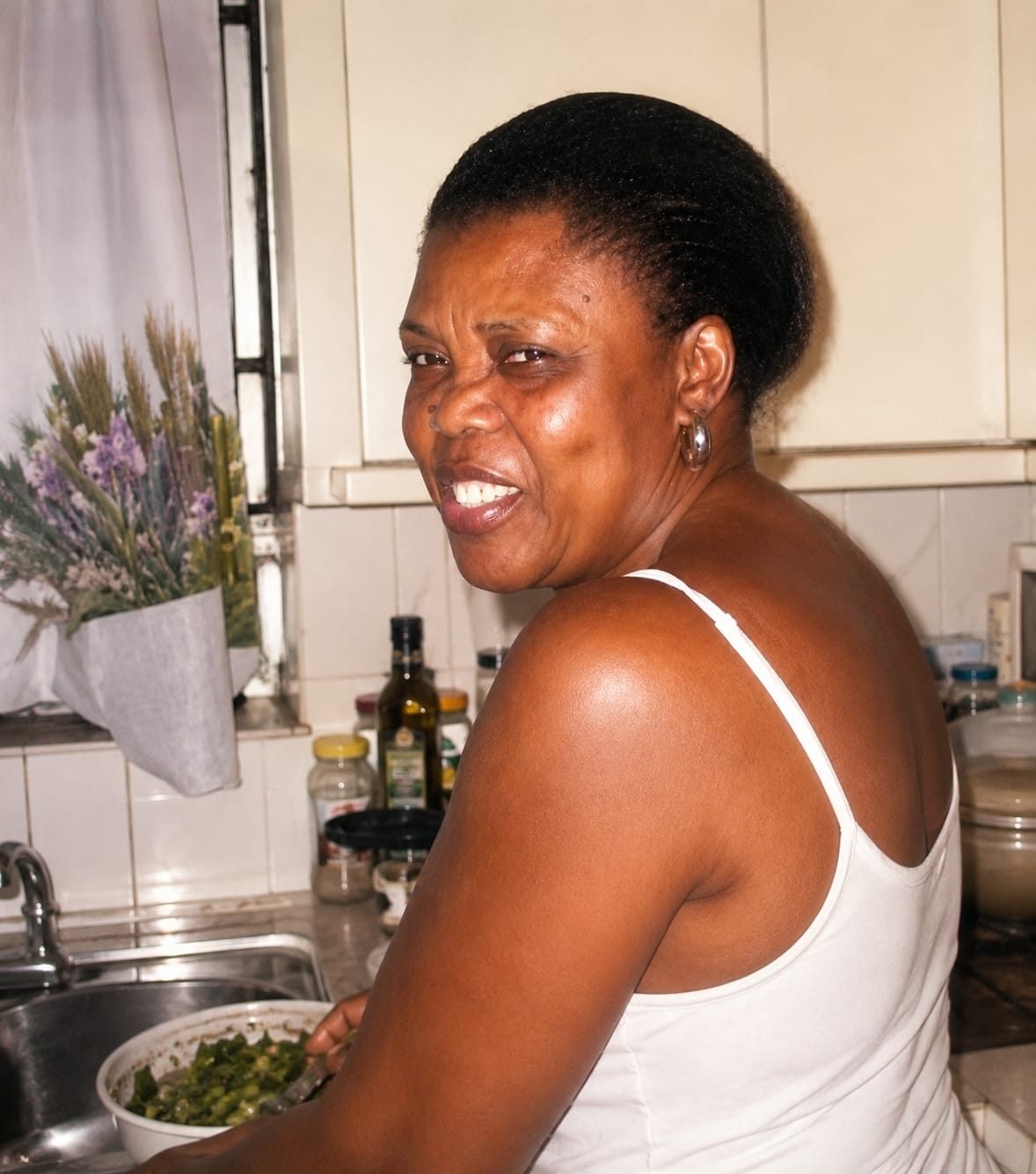 Nadilia "Mommy Norti" Jean in her kitchen